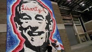 People were able to write love notes to Ron Paul on a giant poster of the candidate with the word Liberty scrawled across his forehead on display at P.A.U.L Fest Saturday, Aug. 25, 2012, at the Florida State Fairgrounds.